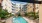 swimming pool with spacious seating areas and reclining chairs