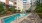 swimming pool with spacious seating areas and reclining chairs